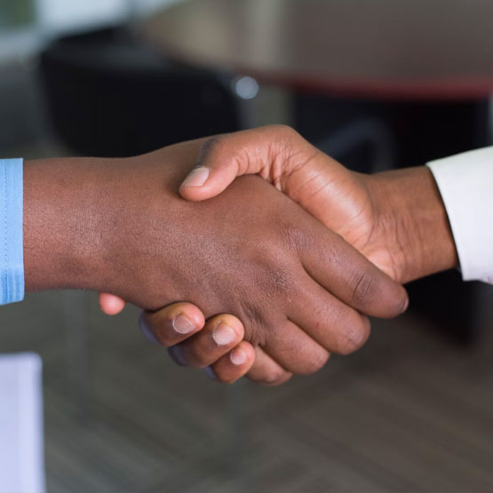 Close up of two people shaking hands