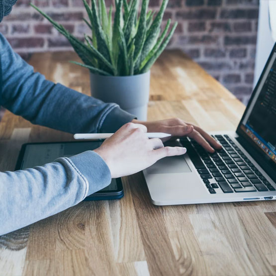 Close up of person using laptop