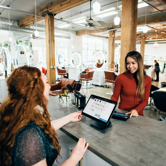 Two business women meeting at place of business